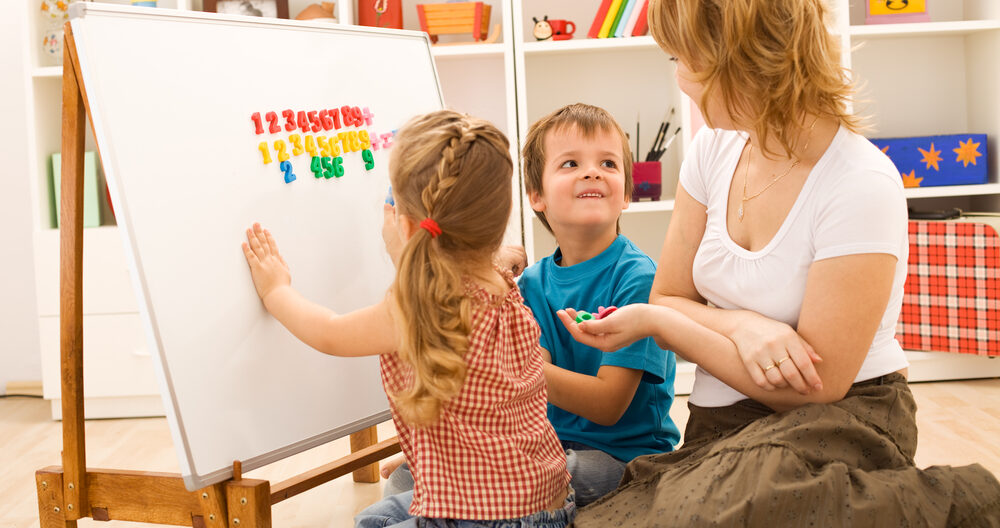 Kids doing math exercises with mom